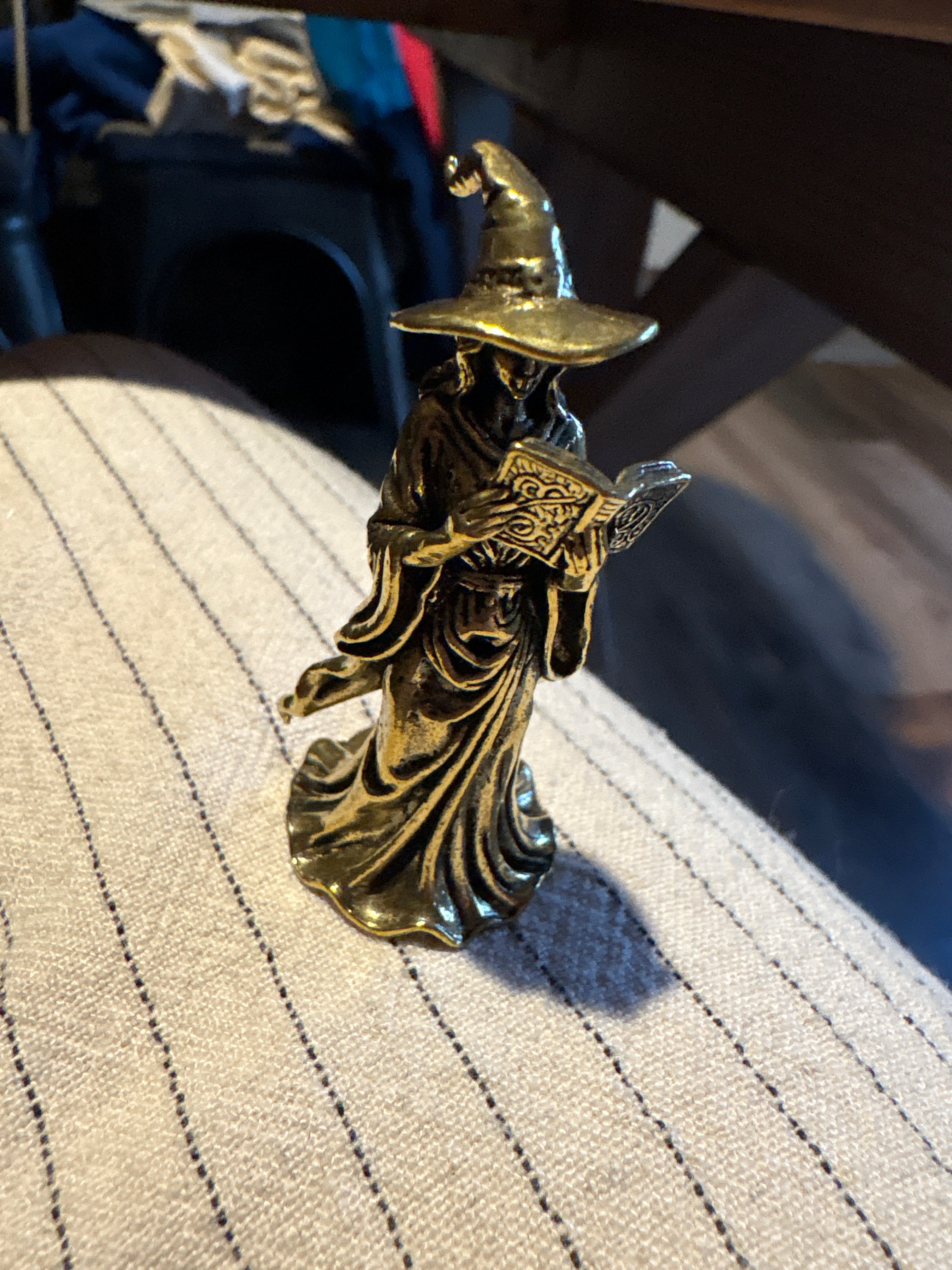 Brass reading witch