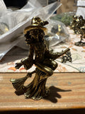 Brass witch on broom