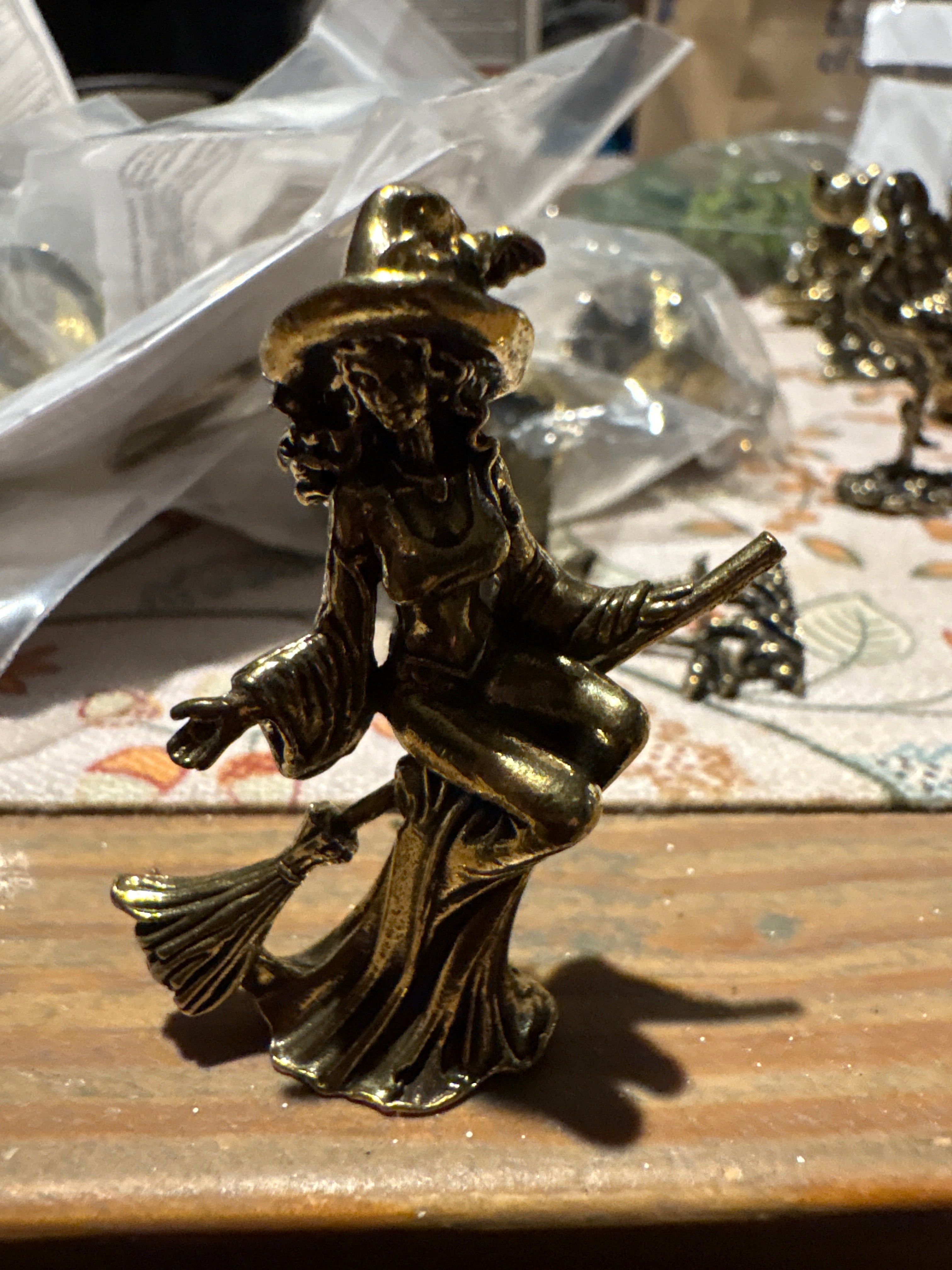 Brass witch on broom