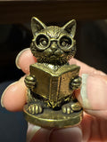 Brass reading cat